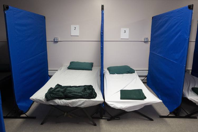 Dividers separate cots to give guests privacy at the Lebanon Emergency Winter Shelter in Lebanon, N.H., on Thursday, Jan. 25, 2024. (Valley News / Report For America - Alex Driehaus) Copyright Valley News. May not be reprinted or used online without permission. Send requests to permission@vnews.com.