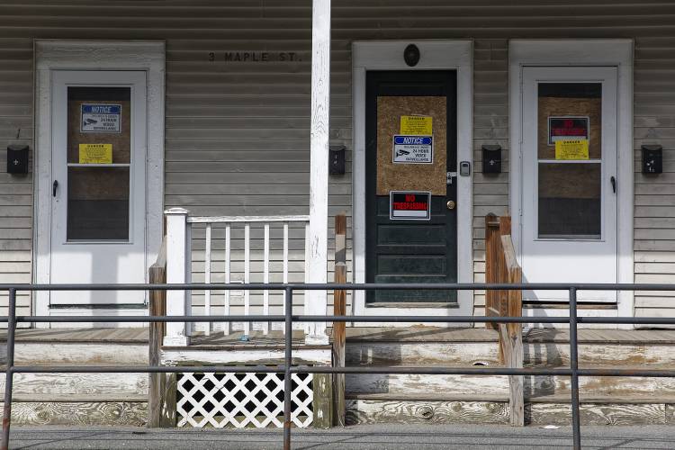 Signs warn against trespassing at a condemned apartment building at 3 Maple Street in West Lebanon, N.H., on Friday, March 22, 2024. (Valley News / Report For America - Alex Driehaus) Copyright Valley News. May not be reprinted or used online without permission. Send requests to permission@vnews.com.