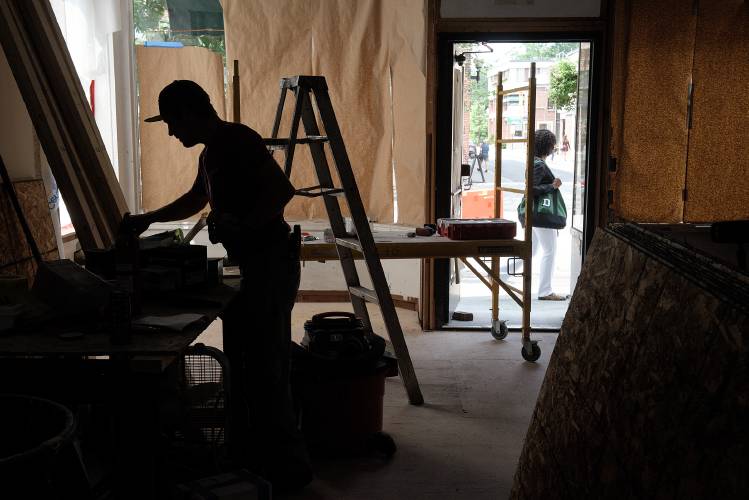 Electrician Bob Morgan, of Lebanon, works on a renovation of the former Traditionally Trendy storefront into a new location for Maven salon in Hanover, N.H., on Wednesday, July 26, 2023. (Valley News - James M. Patterson) Copyright Valley News. May not be reprinted or used online without permission. Send requests to permission@vnews.com.