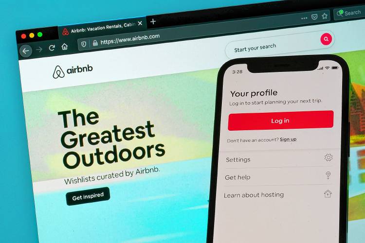 The login page for Airbnb's iPhone app is displayed on a computer displaying Airbnb's website, May 8, 2021, in Washington. Airbnb said Thursday, Aug. 3, 2023, that its second-quarter profit jumped more than 70% over last summer, to $650 million, as revenue rose on strong bookings for summer-vacation rentals. (AP Photo/Patrick Semansky, File)