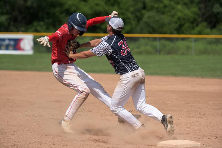 Justin Robinson, of White River Junction Post 84, right, tags Colby Granger, of Bennington, out as he tries to tag up at first in a double play during the second game of their double header at Maxfield Sports Complex in White River Junction, Vt., on Saturday, July 8, 2023. Post 84 won the second game 10-9 in nine innings. (Valley News - James M. Patterson) Copyright Valley News. May not be reprinted or used online without permission. Send requests to permission@vnews.com.