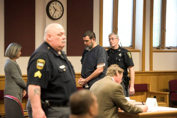 Charged with second-degree murder and manslaughter in the March 2017 killing of Betty Rodriguez in Springfield, Vt., Arnaldo Cruz steps up to the defense table to enter a plea of not guilty by reason of insanity through lawyer Dan Sedon in Windsor Superior Court in White River Junction, Vt., Tuesday, Oct. 9, 2018.  (Valley News - James M. Patterson) Copyright Valley News. May not be reprinted or used online without permission. Send requests to permission@vnews.com.
