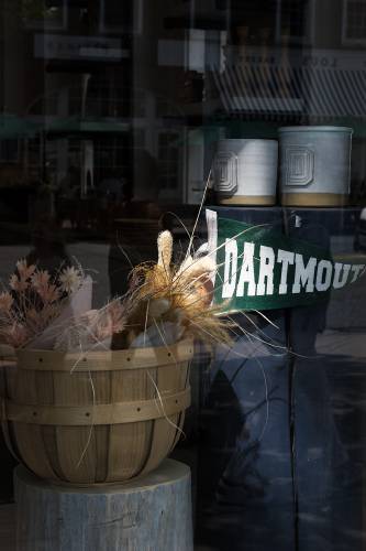 Dartmouth College branded ceramic pots are displayed in the window of Farmhouse Pottery in Hanover, N.H., on Wednesday, July 26, 2023. The Woodstock-based retailer is closing its Hanover location in August. (Valley News - James M. Patterson) Copyright Valley News. May not be reprinted or used online without permission. Send requests to permission@vnews.com.