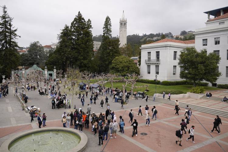 FILE - Students make their way through Sproul Plaza on the University of California, Berkeley, campus Tuesday, March 29, 2022, in Berkeley, Calif. After statewide bans on affirmative action in states from California to Florida, colleges have tried a range of strategies to achieve a diverse student body – giving greater preference to low-income families and admitting top students from communities across their states. But after years of experimentation, some states requiring...