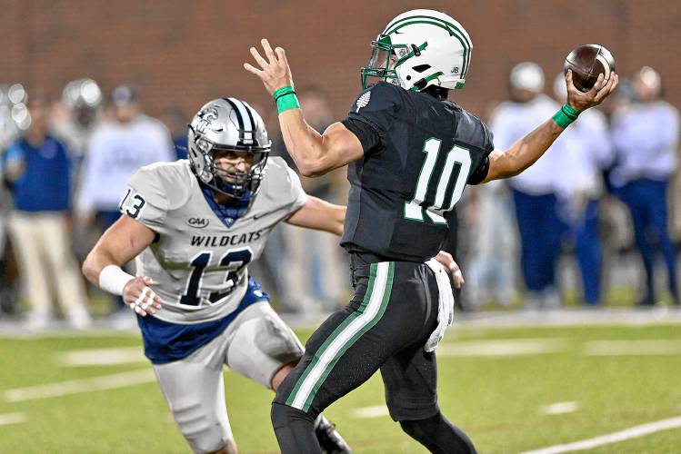 Dartmouth College quarterback Dylan Cadwallader throws under pressure from New Hampshire's Bryce Shaw. UNH won the teams' nonconference game, 24-7, on Sept. 16, 2023, in Durham, N.H.