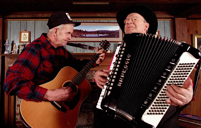 Leon “Woody” Woodward, right, and Don MacLeay have an impromptu jam session at MacLeay’s home in Cornish, N.H. on December 12, 1993. Woodward put together his country and western dance band in the mid-1930s. (Valley News - Geoff Hansen) Copyright Valley News. May not be reprinted or used online without permission. Send requests to permission@vnews.com.
