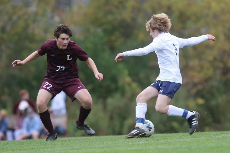 Lebanon High defender Francis Calandrella, left, squares off with John Stark forward Ethan Sinclair during their NHIAA Division II teams' Oct. 17, 2022, in Lebanon, N.H. Lebanon won, 3-1. (Valley News - Tris Wykes) Copyright Valley News. May not be reprinted or used online without permission.