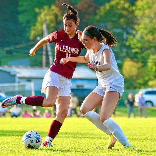 Milford High's Maggie Pelletier, right, and Lebanon's Rayna Graber, meet at the ball during their NHIAA Division II teams' Sept. 6, 2023, contest in Lebanon, N.H. Lebanon won, 2-0. (Valley News - Tris Wykes) Copyright Valley News. May not be reprinted or used online without permission. Send requests to permission@vnews.com.