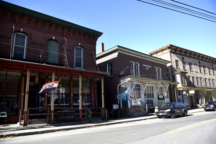 Sitting between two larger buildings, the Arnold Block building in Bethel Vt., has been sold to Chris and Amanda Helali. (Valley News - Jennifer Hauck) Copyright Valley News. May not be reprinted or used online without permission. Send requests to permission@vnews.com.