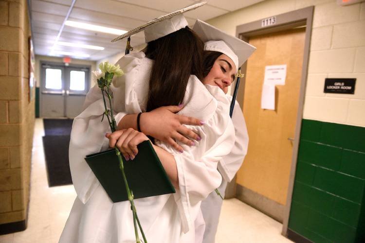 At the end of the Rivendell Academy's commencement, fellow graduates Jillian Bushee, left, and Lily Otis embrace on Saturday, June 10, 2023, in Orford, N.H. (Valley News - Jennifer Hauck) Copyright Valley News. May not be reprinted or used online without permission. Send requests to permission@vnews.com.