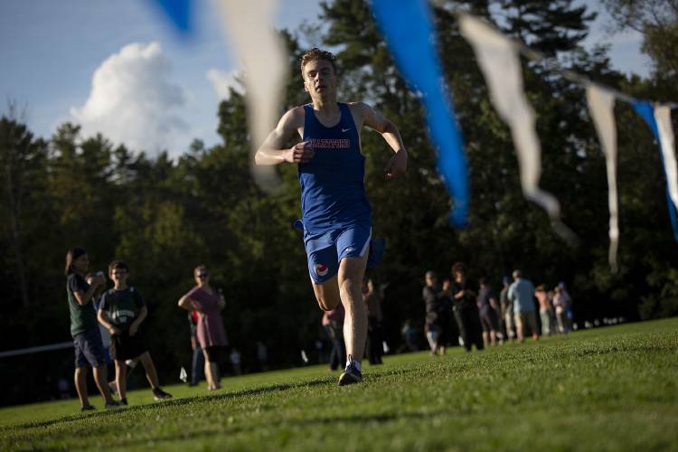 Hartford senior Jack Fournier-Stephens crosses the finish line during a cross country meet at Thetford Academy in Thetford, Vt., on Tuesday, Sept. 12, 2023. Fournier-Stephens finished 14th with a time of 20:40. (Valley News / Report For America - Alex Driehaus) Copyright Valley News. May not be reprinted or used online without permission. Send requests to permission@vnews.com.