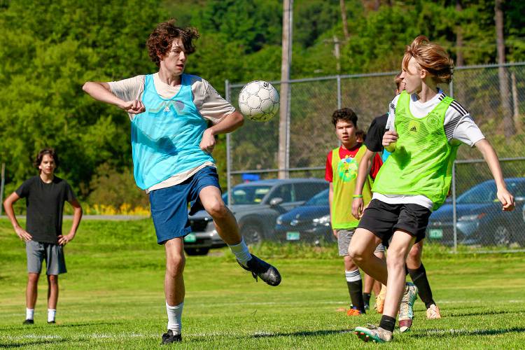 Woodstock High’s Finn Costello, left, and Luke Hecker clash over the ball during an Aug. 23, 2023, practice in Woodstock, Vt. (Valley News - Tris Wykes) Copyright Valley News. May not be reprinted or used online without permission. Send requests to permission@vnews.com.