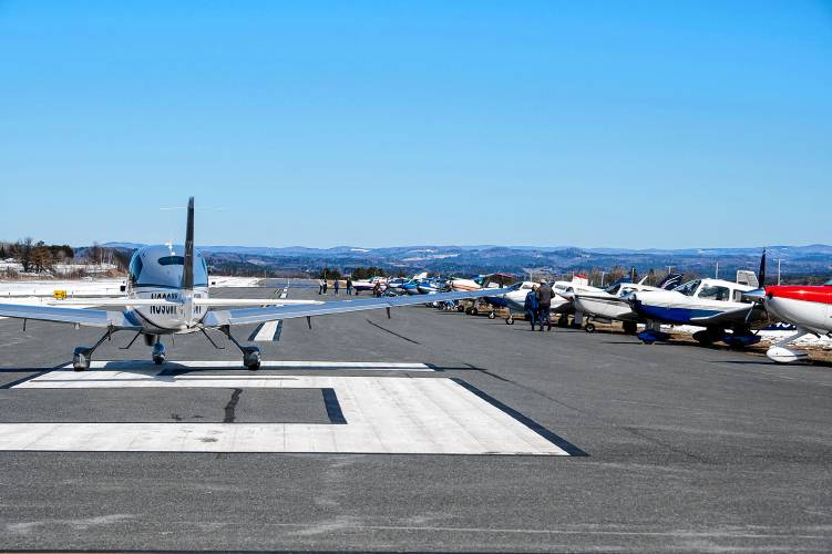 Private planes park along a runway at E.F. Knapp airport in Berlin prior to the eclipse on Monday, April 8, 2024. The airport was expecting as many as 100 private planes to land at the small airport. (VtDigger - Jeb Wallace-Brodeur)
