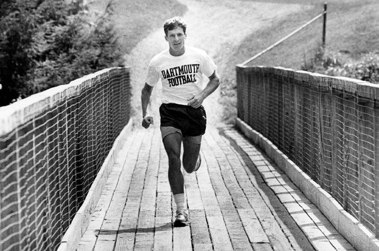 Dartmouth head football coach Buddy Teevens takes a noon run across a bridge at the golf course in Hanover, N.H., on Aug. 31, 1988. (Valley News - Stephanie Wolff) Copyright Valley News. May not be reprinted or used online without permission. Send requests to permission@vnews.com.