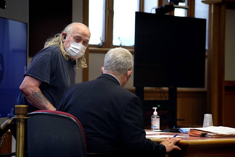 Frank Sanville, of South Royalton, Vt., glances back at family members while taking a seat at the defendant's table with his attorney Robert Sussman at Windsor Superior Court in White River Junction, Vt., on July 27, 2022. Sanville pleaded guilty to second degree murder in the March 2018 death of his wife Wanda Sanville and aggravated assault with a weapon after pointing his rifle at brother-in-law Todd Hosmer. (Valley News - Geoff Hansen) Copyright Valley News. May not be reprinted or used online without permission. Send requests to permission@vnews.com.