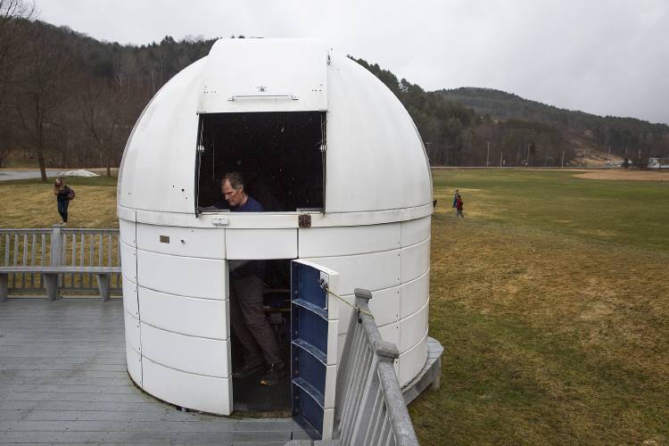 Rob Hanson, co-director of Horizons Observatory, closes the hatch of the observatory at the Prosper Valley School in South Pomfret, Vt., on Wednesday, April 3, 2024. Hanson is looking forward to experiencing a total solar eclipse for the first time, and said if cloud cover prevents him from doing so on Monday he’s considering visiting Spain for an upcoming eclipse in 2026. (Valley News / Report For America - Alex Driehaus) Copyright Valley News. May not be reprinted or used online without permission. Send requests to permission@vnews.com.