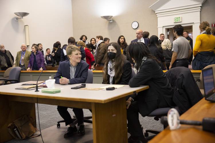 From left, defense attorney Kira Kelley talks to her clients Dartmouth junior Roan Wade and freshman Kevin Engel at the conclusion of the first day of their trial for misdemeanor criminal trespassing at Lebanon District Court in Lebanon, N.H., on Monday, Feb. 26, 2024. The pair’s supporters filled the courtroom after participating in a demonstration in support of Palestine outside. (Valley News / Report For America - Alex Driehaus) Copyright Valley News. May not be reprinted or used online without permission. Send requests to permission@vnews.com.