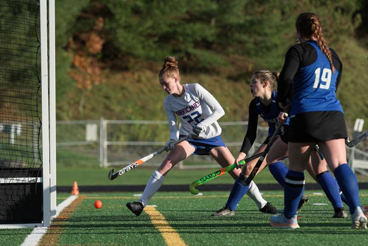 Hailey Vanasse, 22, of Hartford, ushers the ball past Alexandra Weller, of U-32, second from right, and into the net during the Hurricanes' 4-1 VPA Division 2 semifinal win at St. Johnsbury Academy in St. Johnsbury, Vt., on Tuesday, Oct. 31, 2023. (Valley News - James M. Patterson) Copyright Valley News. May not be reprinted or used online without permission. Send requests to permission@vnews.com.