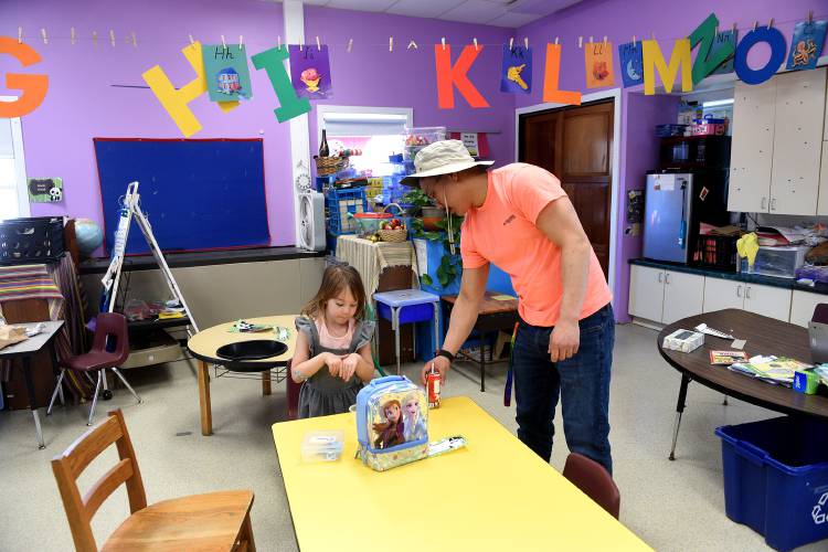 Cornish Elementary School Pre-K teacher Lee Cogan helps student Eliana Parker, 4, get ready for recess at the school in Cornish, N.H. on Monday, April 4, 2022. Students and staff at the school can no longer drink the school's well water due to PFOA contamination.(Valley News - Jennifer Hauck) Copyright Valley News. May not be reprinted or used online without permission. Send requests to permission@vnews.com.
