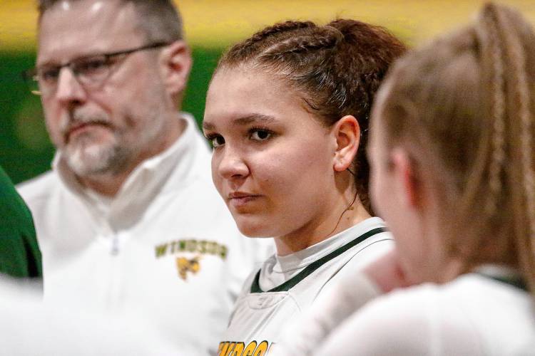 Windsor High's Sophia Rockwood listens to a teammate talk after their basketball team's 53-32 defeat of West Rutland on Feb. 22, 2024, in Windsor, Vt. Rockwood led the Yellowjackets with 19 points. (Valley News - Tris Wykes) Copyright Valley News. May not be reprinted or used online without permission. —Tris Wykes