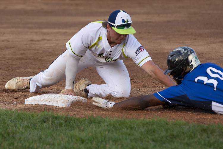 Upper Valley Nighthawks’ Jake Bullard (23) tags out North Adams SteepleCats’ DM Jefferson (30) as he attempts to slide back to third base during a game at Maxfield Sports Complex in White River Junction, Vt., on Friday, June 30, 2023. (Valley News / Report For America - Alex Driehaus) Copyright Valley News. May not be reprinted or used online without permission. Send requests to permission@vnews.com.