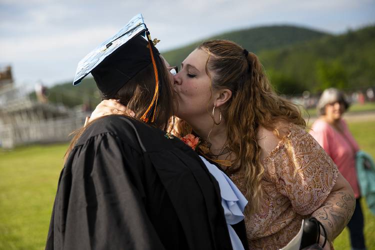 Ali Cunningham, right, of Newport, N.H., kisses her daughter Ciara Jaco on the cheek before her graduation ceremony at Newport High School in Newport on Thursday, June 15, 2023. (Valley News / Report For America - Alex Driehaus) Copyright Valley News. May not be reprinted or used online without permission. Send requests to permission@vnews.com.
