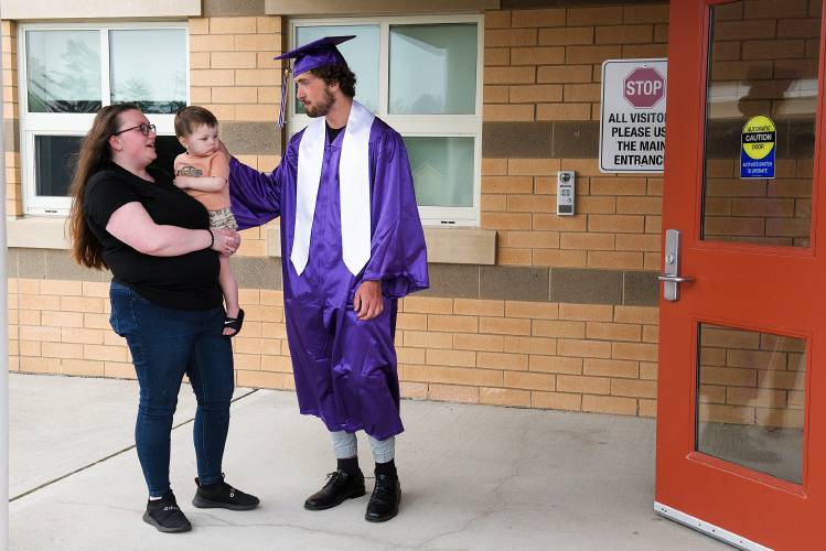 Graduating senior Connor Cantlin, right, gets a visit from his older sister Breanna Prime, of Littleton, N.H., herself a former Mascoma student, and his nephew Daniel Gola, 1, before  Mascoma High School commencement in West Canaan, N.H., on Friday, June 16, 2023. (Valley News - James M. Patterson) Copyright Valley News. May not be reprinted or used online without permission. Send requests to permission@vnews.com.