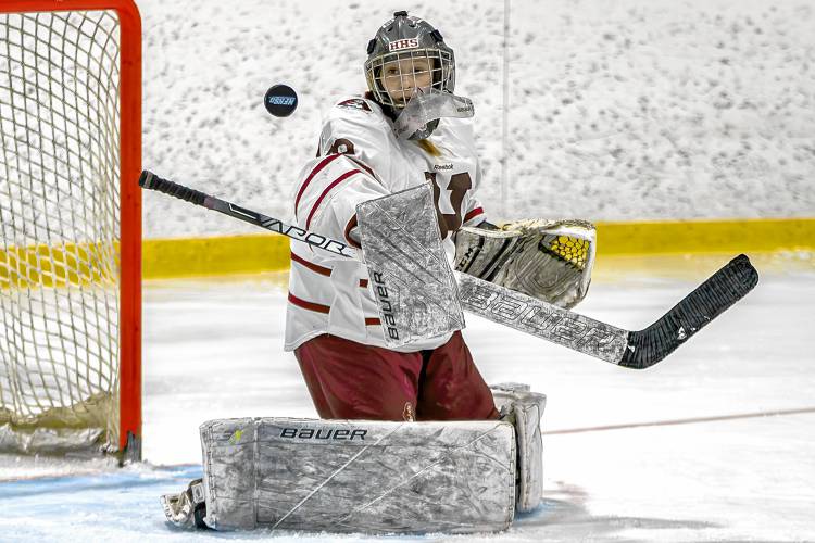 Hanover High goaltender Eleanor Edson watches a shot sail past during her NHIAA Division I team's 3-0 defeat of Lebanon during a March 1, 2024, playoff quarterfinal at Campion Rink in West Lebanon, N.H. Edson made nine saves during a 3-0 victory. (Paul Stinson photograph)