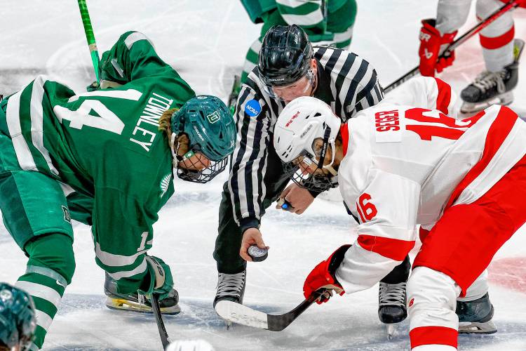 Dartmouth College's Steven Townley, a Woodstock High graduate, and Cornell's Gabriel Seger face off during the ECAC teams' March 22, 2024, playoff semifinal at Herb Brooks Arena in Lake Placid, N.Y. Cornell won, 6-3. (Valley News - Tris Wykes) Copyright Valley News. May not be reprinted or used online without permission. 