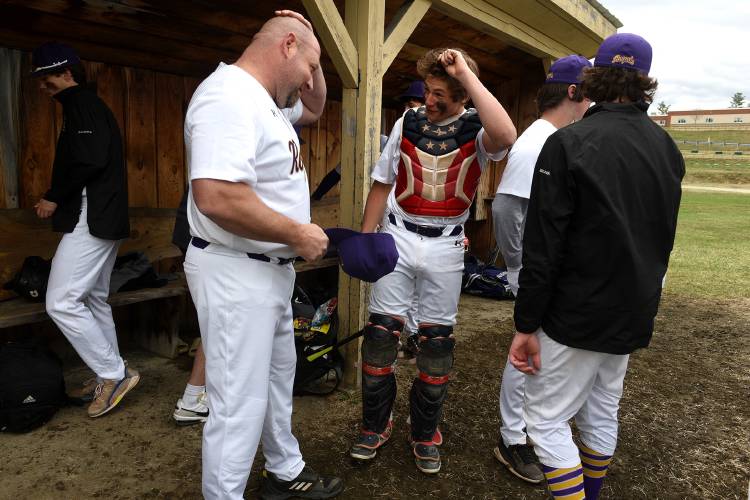 Mascoma baseball coach Britt Lewis teases his son Ethan Lewis about getting a haircut before the start of their game in West Canaan, N.H., on Tuesday, April 18, 2023. (Valley News - Jennifer Hauck) Copyright Valley News. May not be reprinted or used online without permission. Send requests to permission@vnews.com.