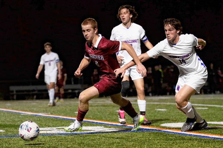 Hanover High's Andrew McGuire, left, has a step on Winnacunnet's Noah Souther during the NHIAA Division I teams' playoff quarterfinal game on Oct. 27, 2023, at Merriman-Branch Field in Hanover, N.H. Hanover won, 5-1. (Valley News - Tris Wykes) Copyright Valley News. May not be reprinted or used online without permission. Send requests to permission@vnews.com.