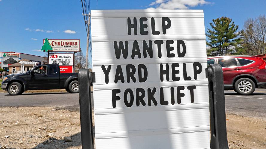 A help wanted sign is posted outside Cyr Lumber in Windham, N.H., Thursday, May 7, 2020. Roughly 33.5 million people have now filed for jobless aid in the seven weeks since the coronavirus began forcing millions of companies to close their doors and slash their workforces. (AP Photo/Charles Krupa)