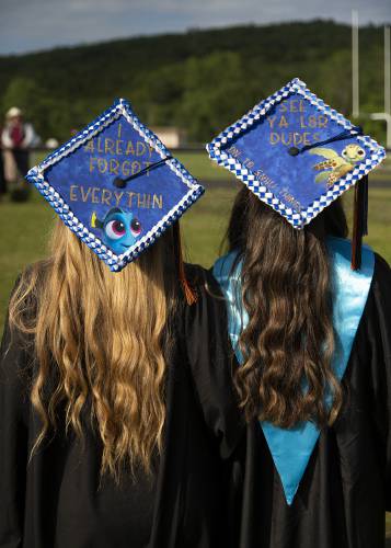 Julie O’Neill, left, and Kelsey Carmichael show off their coordinated “Finding Nemo” mortar boards before their graduation ceremony at Newport High School in Newport, N.H., on Thursday, June 15, 2023. (Valley News / Report For America - Alex Driehaus) Copyright Valley News. May not be reprinted or used online without permission. Send requests to permission@vnews.com.