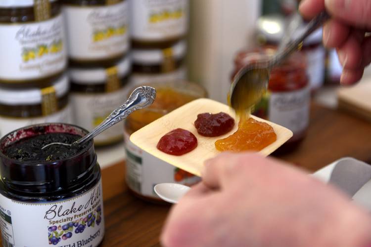 A customer tries a few of the many samples at Blake Hill Preserves in Windsor, Vt., on Tuesday, April 9, 2024. As part of a larger financing package, the business is applying for funding through the Town of Windsor to support a $2.7 million facility expansion in Artisan Park. (Valley News - Jennifer Hauck) Copyright Valley News. May not be reprinted or used online without permission. Send requests to permission@vnews.com.