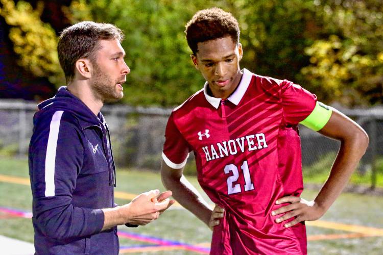 Hanover High boys soccer associate head coach Sam Farnham, left, speaks with Ryder Hayes at halftime of an Oct. 27, 2023, NHIAA Division I playoff quarterfinal game on Merriman-Branch Field in Hanover, N.H. Hanover won, 5-1. (Valley News - Tris Wykes) Copyright Valley News. May not be reprinted or used online without permission. Send requests to permission@vnews.com.