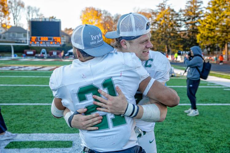 Dartmouth College quarterback Nick Howard, rear, gets an embrace from running back Tyler Green (21) following the Big Green’s 38-13 Ivy League football win over Brown on Saturday, Nov. 18, 2023, in Providence, R.I., a victory that gave Dartmouth a share of its 21st league championship.