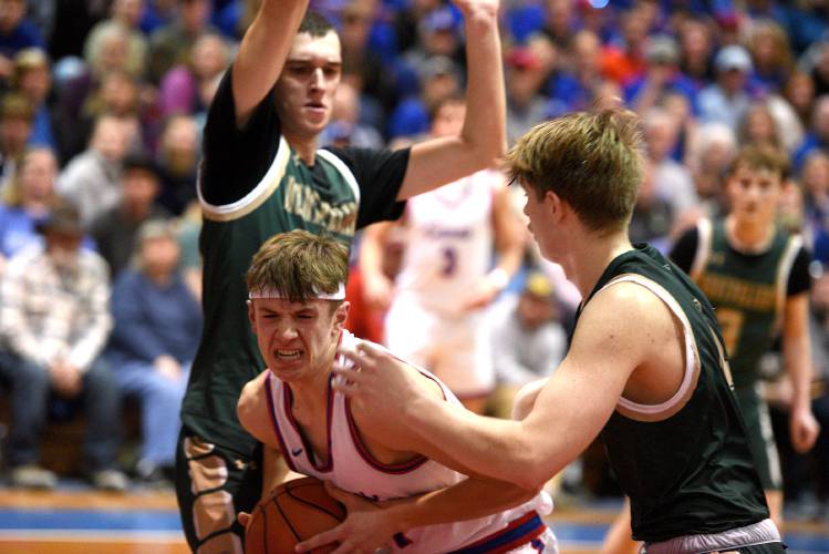 Hartford's Zach Johnson looks for an outlet with Montpelier's Atif Milak and Kleo Bridge guarding him during the VPA D-II boys basketball championship in Barre, Vt., on Saturday, March 2, 2024. Montpelier won, 58-49. (Valley News - Jennifer Hauck) Copyright Valley News. May not be reprinted or used online without permission. Send requests to permission@vnews.com.