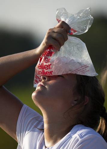 Mascoma defender Bella Davis (14) holds a bag of ice to her forehead to cool down at halftime during a girls varsity soccer game at Newport Middle High School in Newport, N.H., on Wednesday, Sept. 6, 2023. Mascoma won, 4-1. (Valley News / Report For America - Alex Driehaus) Copyright Valley News. May not be reprinted or used online without permission. Send requests to permission@vnews.com.