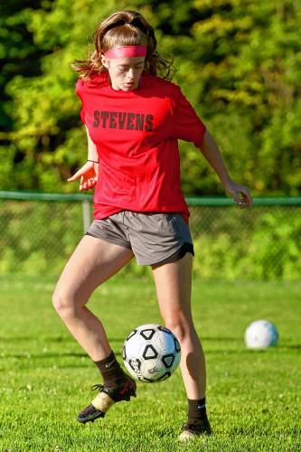Stevens High’s Maddy Chambers gets a touch on the ball during her team’s Aug. 14, 2023, practice at Monadnock Park in Claremont, N.H. (Valley News - Tris Wykes) Copyright Valley News. May not be reprinted or used online without permission. Send requests to permission@vnews.com.