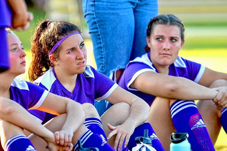 Kayli Stapelfeld, center, shown at halftime of a Mascoma High girls soccer game on Oct. 14, 2022, in West Canaan, N.H. Emily Seiler is at left and Natalee Pettersen is at right. 