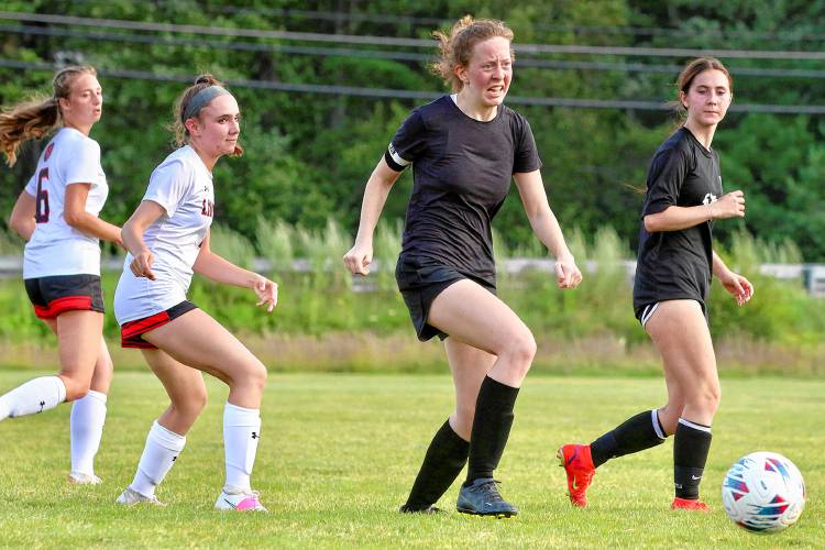 Mascoma High’s Cora Peters, second from right, dribbles away from Lin-Wood pressure during the NHIAA teams’ Aug. 21, 2023, scrimmage in West Canaan, N.H. (Valley News - Tris Wykes) Copyright Valley News. May not be reprinted or used online without permission. Send requests to permission@vnews.com.