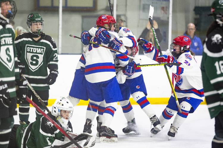 Hartford teammates celebrate after Zoe Zanleoni’s (19) game-winning goal in overtime of a VPA D-II girls hockey quarterfinal game against Stowe High School at Wendell A. Barwood Arena in White River Junction, Vt., on Wednesday, Feb. 28, 2024. Hartford won, 2-1. (Valley News / Report For America - Alex Driehaus) Copyright Valley News. May not be reprinted or used online without permission. Send requests to permission@vnews.com.