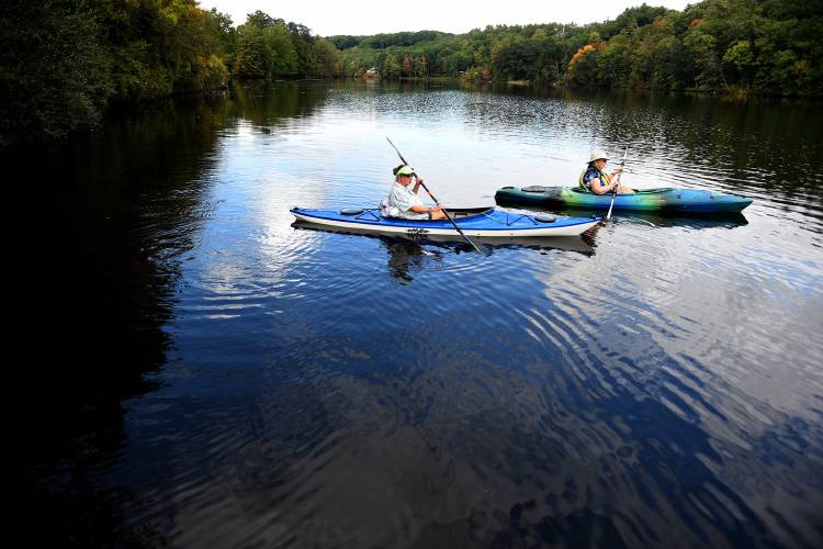 From Kilowatt Field, Jane Svetaka of Hartland, Vt., and Nancy Maynard, of White River Junction, Vt., decide where to paddle on the Connecticut River on Wednesday, Oct. 6, 2021, in Wilder, Vt. The women kayak on the river one or two times a week, spending time photographing wildlife on the river. (Valley News - Jennifer Hauck) Copyright Valley News. May not be reprinted or used online without permission. Send requests to permission@vnews.com.