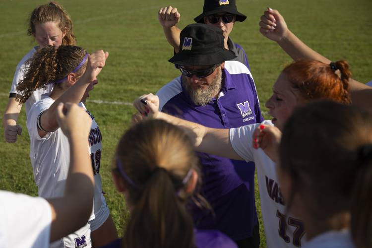 Mascoma head coach Mark Rockwood gives his team a pep talk as they take a water break during a girls varsity soccer game at Newport Middle High School in Newport, N.H., on Wednesday, Sept. 6, 2023. Mascoma won, 4-1. (Valley News / Report For America - Alex Driehaus) Copyright Valley News. May not be reprinted or used online without permission. Send requests to permission@vnews.com.