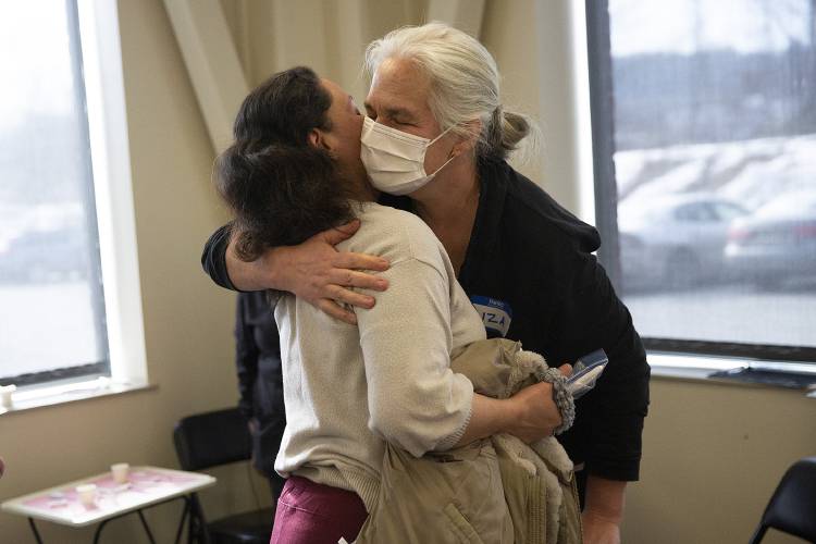 Margarita Benavidez, left, of Lebanon, N.H., hugs Liza Eager, public health specialist with the Vermont Department of Health, after receiving dental care during a free dental clinic at the Vermont Agency of Human Services Hartford District Office Building in White River Junction, Vt., on Friday, Feb. 9, 2024. (Valley News / Report For America - Alex Driehaus) Copyright Valley News. May not be reprinted or used online without permission. Send requests to permission@vnews.com.