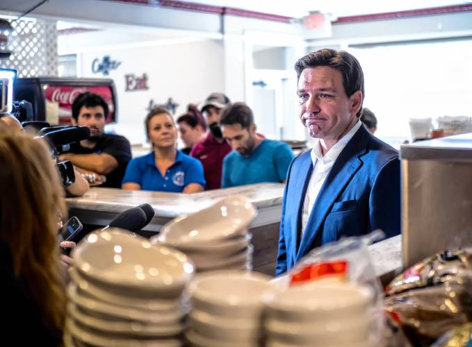 Florida Gov. Ron DeSantis talks with the press at the Windmill Restaurant on Tuesday morning, August 1, 2023.
