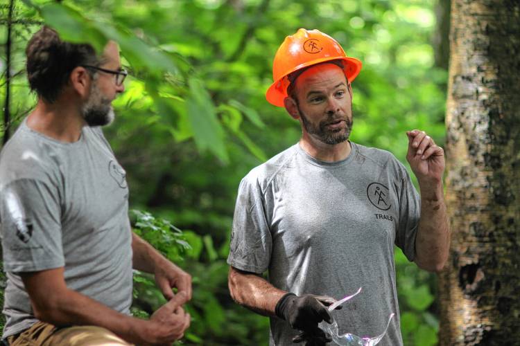 Alexander DeLucia and Matt Moore, right, discuss the restoration of the Old Bridle Trail along the Franconia Ridge loop in the White Mountains. The trail, which is one of the most popular in New Hampshire, will be rehabilitated over the course of the next 5 years thanks to federal funding from Senator Jeanne Shaheen's office.  