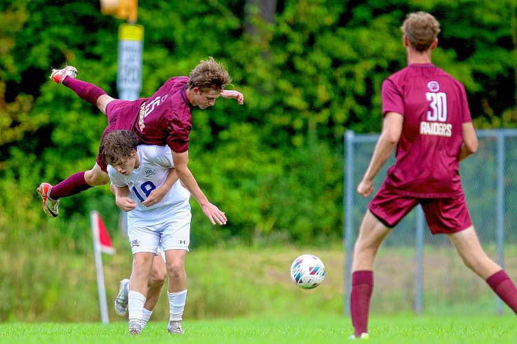 Lebanon High's Otto Bourne falls over a Hollis-Brookline opponent during the NHIAA Division II teams' Sept. 11, 2023, game in Lebanon, N.H. Lebanon won, 5-1. (Valley News - Tris Wykes) Copyright Valley News. May not be reprinted or used online without permission. Send requests to permission@vnews.com.