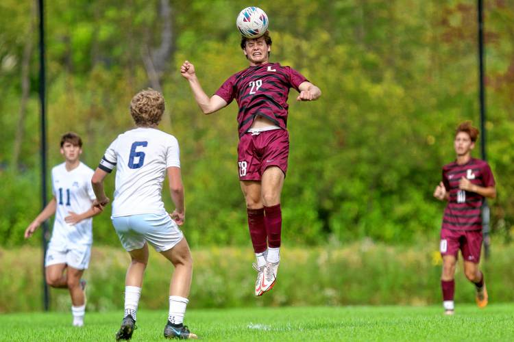 Lebanon High's Abe Pearson leaps to head the ball during his NHIAA Division II team's 5-1 defeat of Hollis-Brookline on Sept. 11, 2023, in Lebanon, N.H. (Valley News - Tris Wykes) Copyright Valley News. May not be reprinted or used online without permission. Send requests to permission@vnews.com.