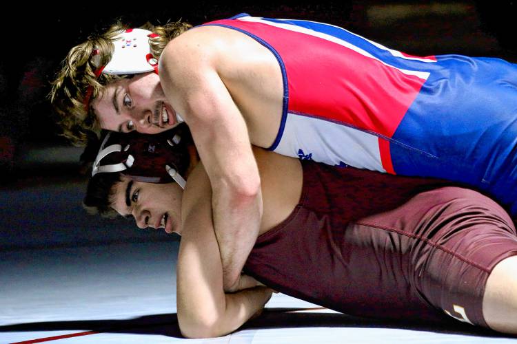 Lebanon High's John Polk, bottom, tries to break free from John Stark's Stephen Johnston during the NHIAA Division III teams' competition on Dec. 13, 2023. John Stark won, 66-18. (Valley News - Tris Wykes) Copyright Valley News. May not be reprinted or used online without permission. Send requests to permission@vnews.com.